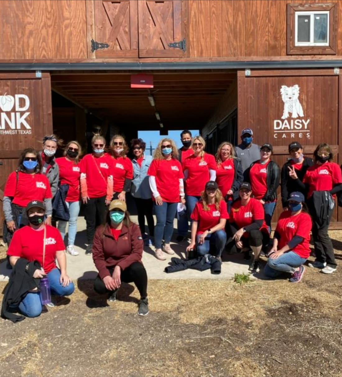 Option One team members in red shirts volunteering together